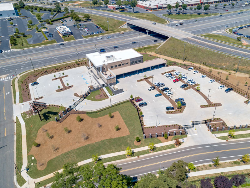 Aerial photograph of the CMPD independence station showing the large parking lot and hardscapes from the rear.