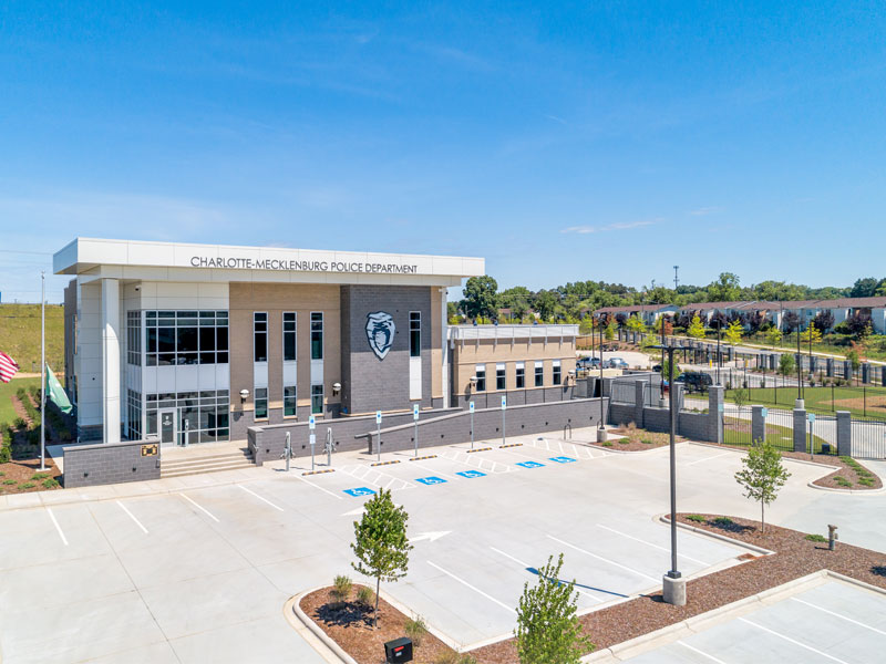 Photo of a parking lot and hardscapes in front of the CMPD independence station.