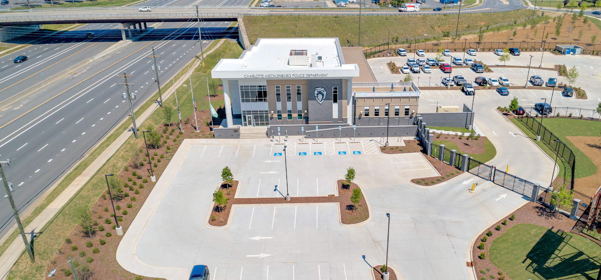 Aerial photograph of the CMPD independence station from the front, highlighting the large parking areas and hardscapes.