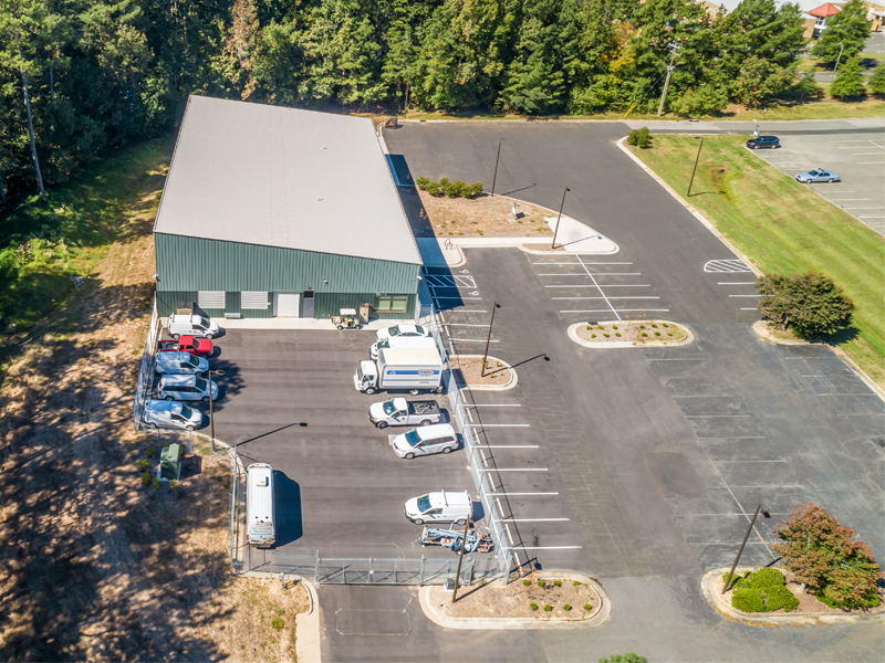 Durham Tech Facility front end and fenced-in parking lot.