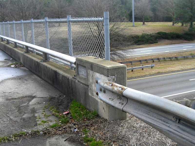 Fencing and guard rail damage being inspected for the NBIS Structures Inspection.